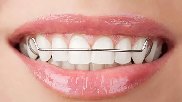 Dark haired family smiling because of the services provided by Grove City Dental
